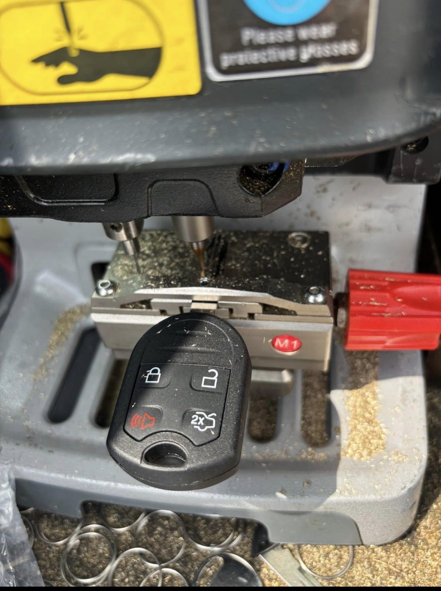 Automotive key being cut by City Locksmith Taylor