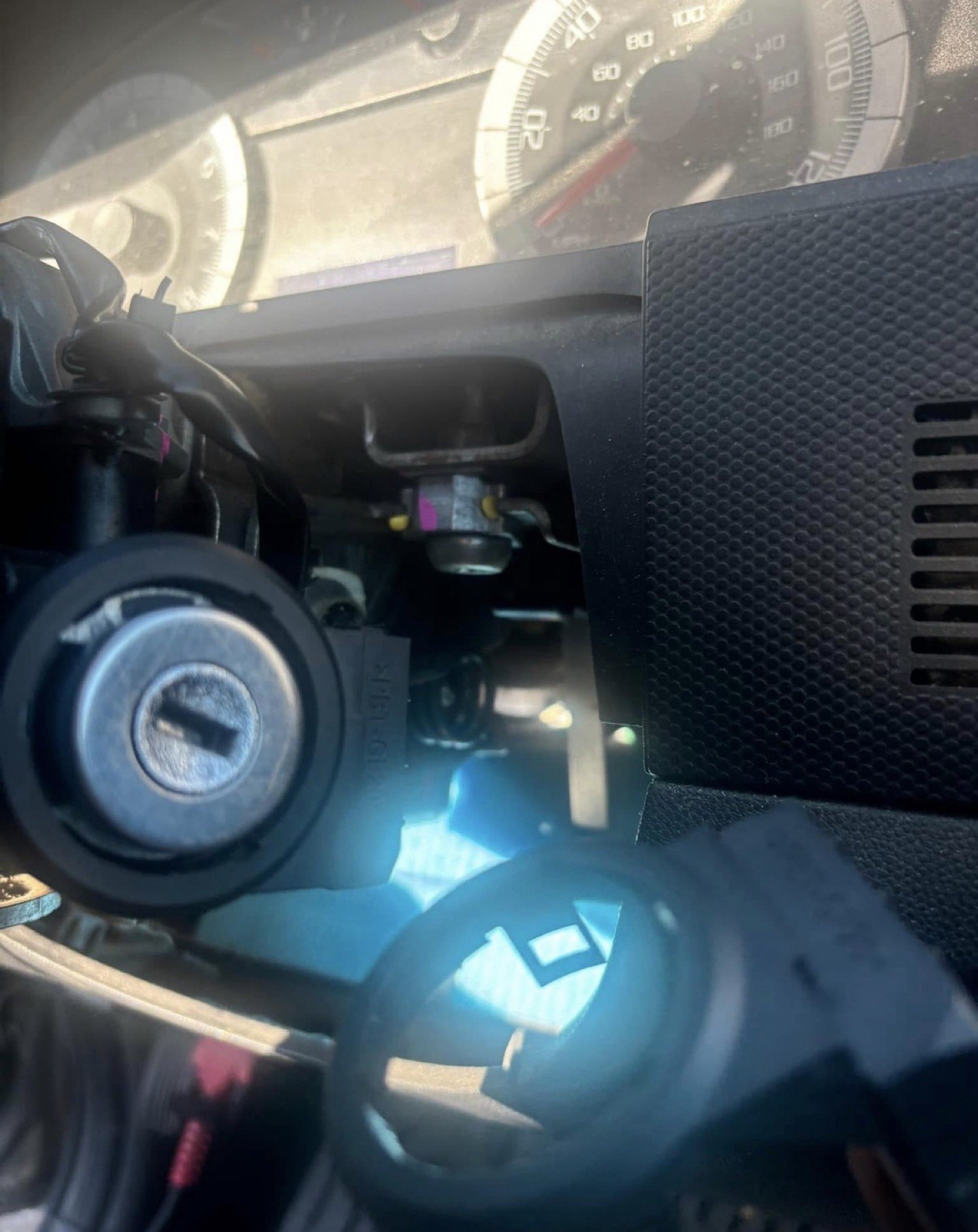 Broken key in an automotive ignition cylinder during locksmith extraction