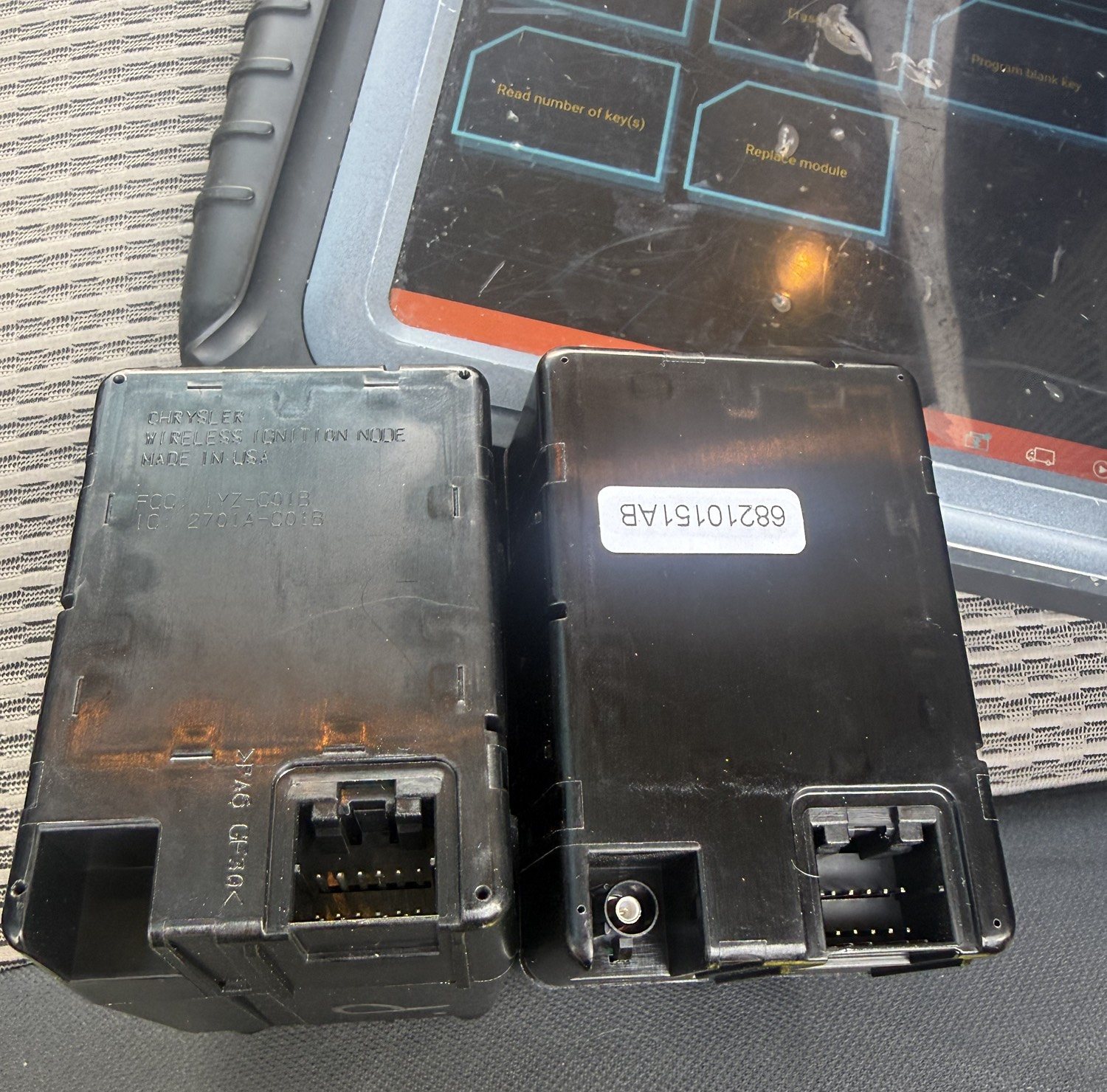 Old and new Chrysler wireless ignition nodes after a module swap on a 2010 Dodge Ram in Taylor