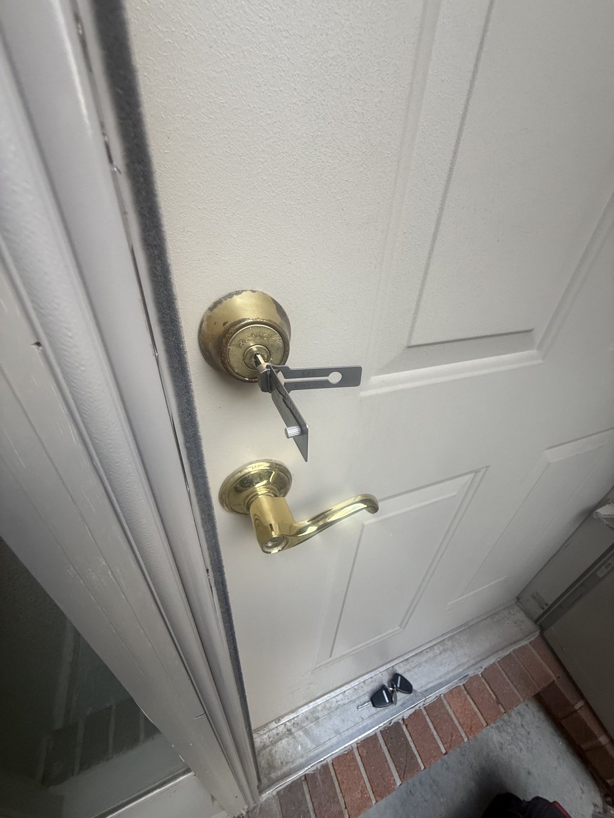 Lishi in a residential deadbolt during a house lockout in Riverview by City Locksmith Taylor