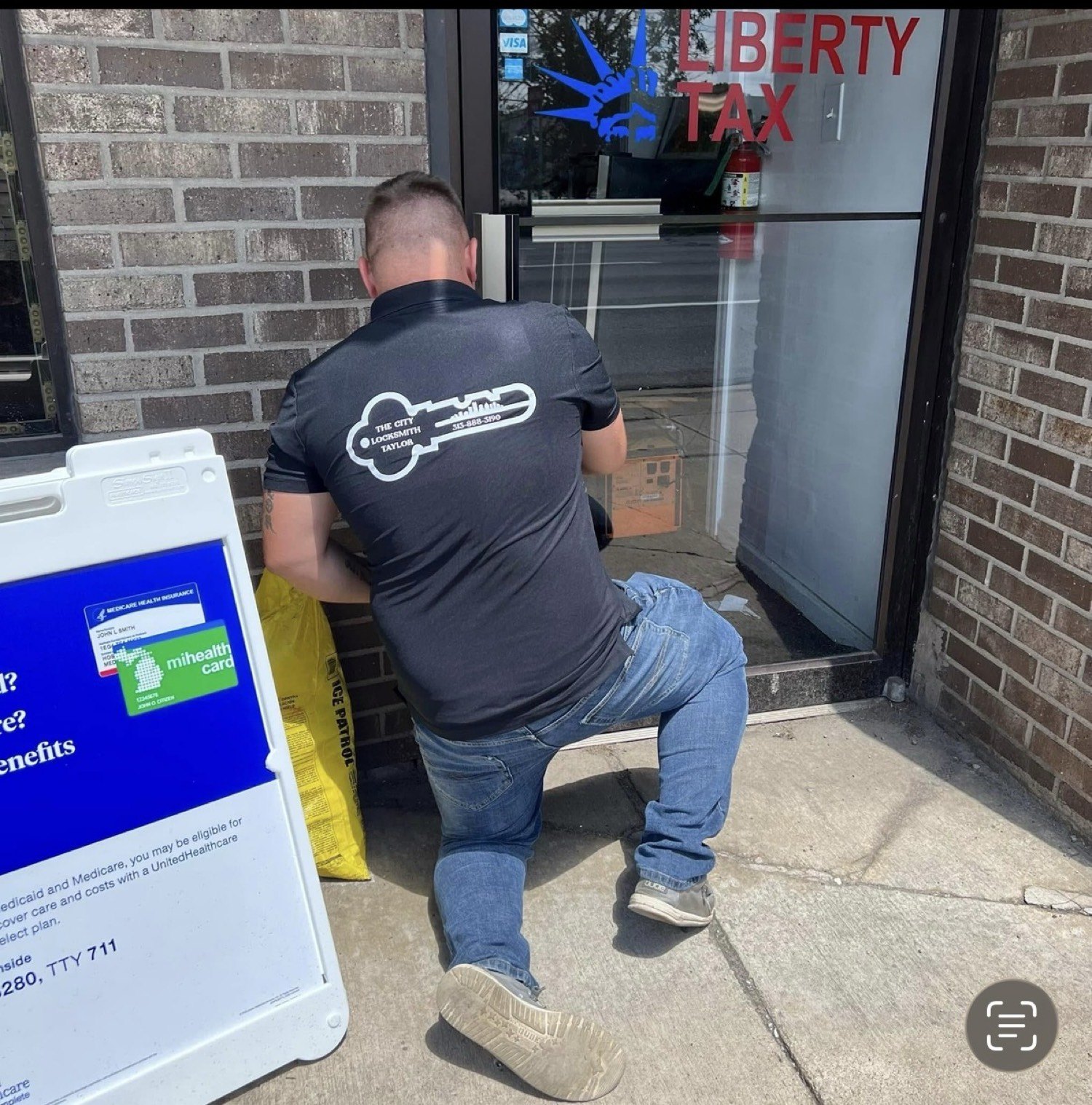 Ryan Taylor unlocking the commercial door at Liberty Tax in Taylor