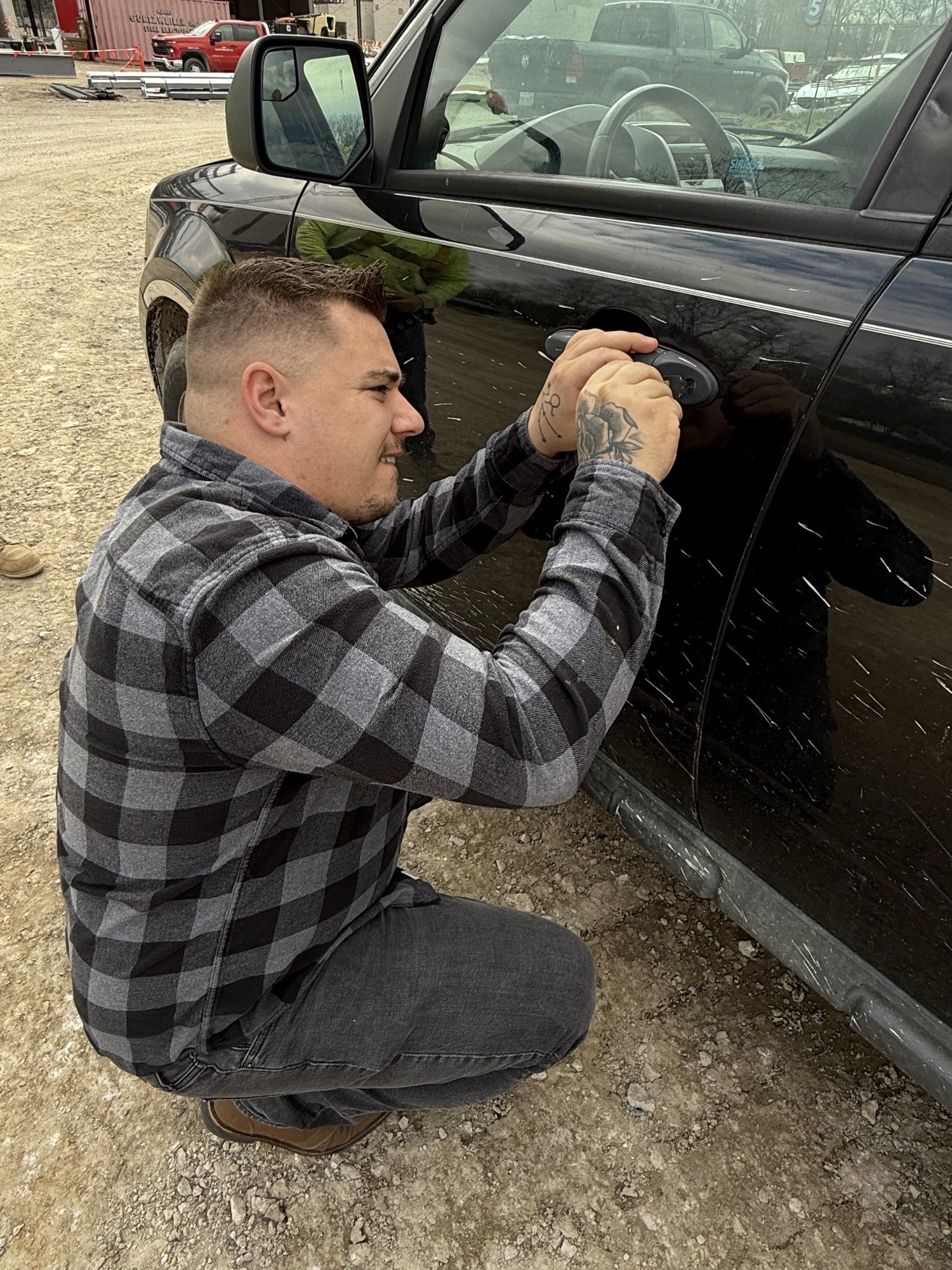 Ryan Taylor unlocking a vehicle with a Lishi lockpick in Dearborn, October 2025