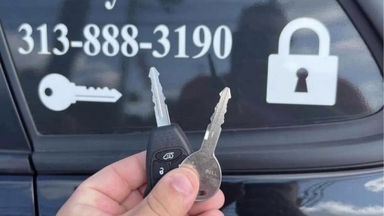 Ryan Taylor holding keys in front of a City Locksmith Taylor service vehicle