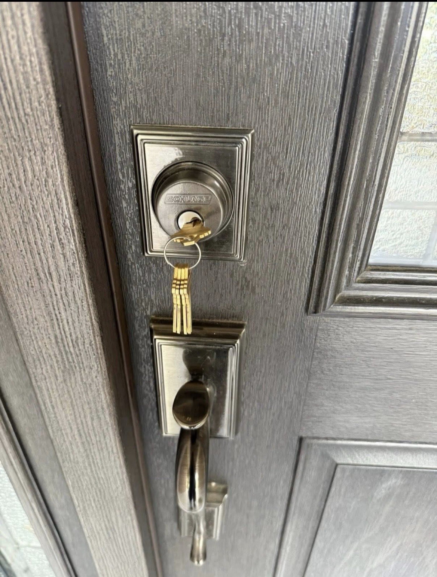 New house keys in a Schlage deadbolt after a residential rekey by City Locksmith Taylor