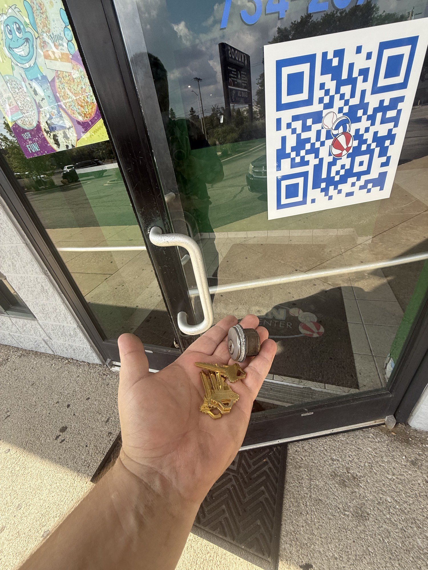 Storefront cylinder and new keys after a commercial rekey in Woodhaven by City Locksmith Taylor